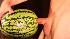 Muscular Stud Fucks and Cums on Watermelon