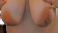 Busty curly brunette with big boobs fucks on couch