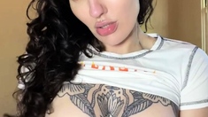 Busty curly brunette with big boobs fucks on couch