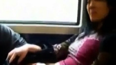 Asian milf rubs her clit on a train.